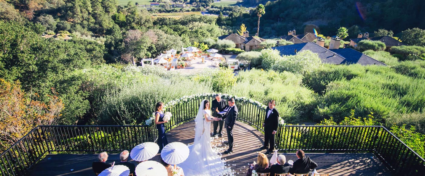Couple enjoying wine at a winery — gifting wine country experiences as wedding registry ideas