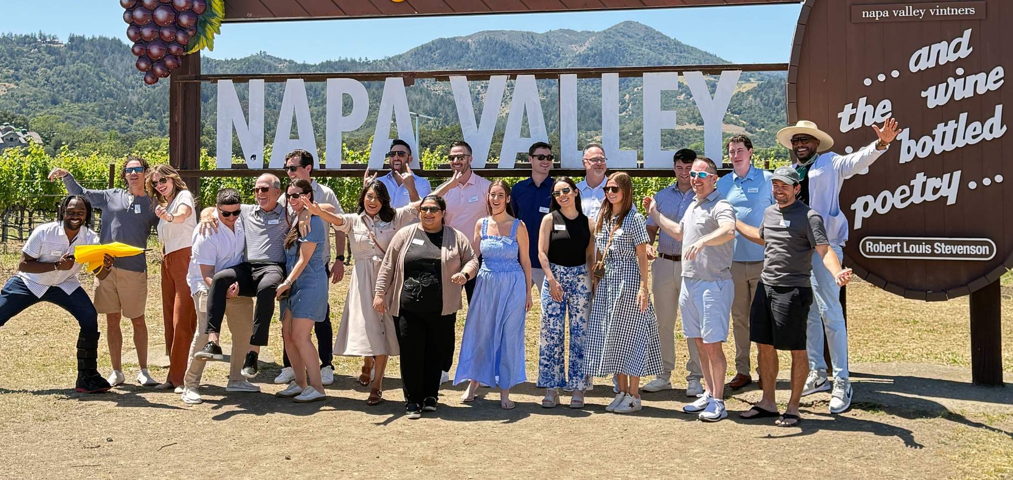 Corporate group celebrating at the Napa Valley sign