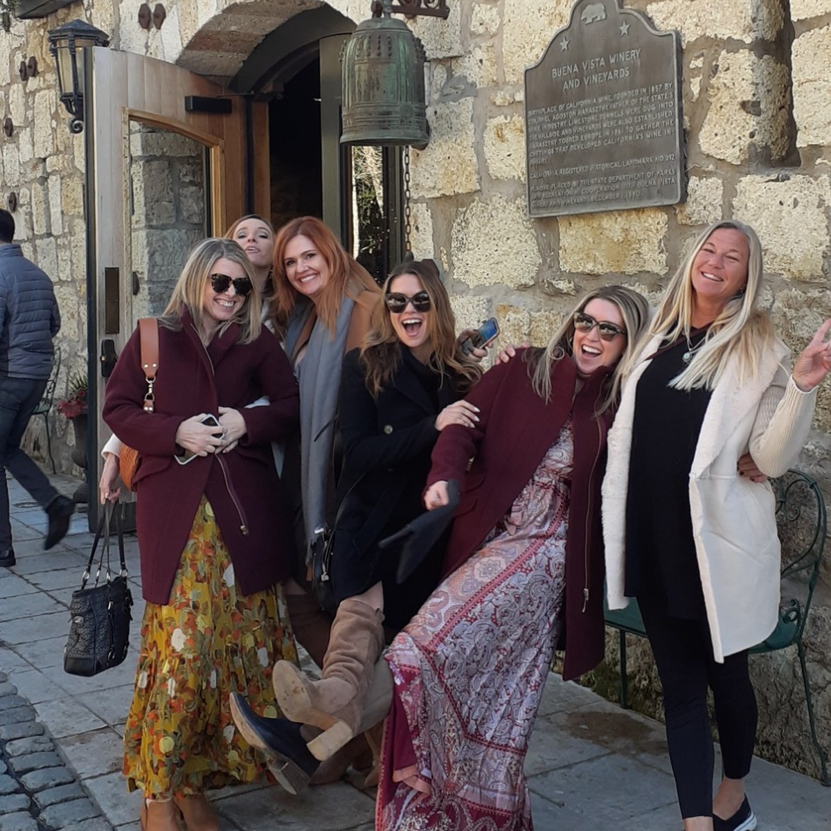 Guests enjoying a private wine tour at a historic winery
