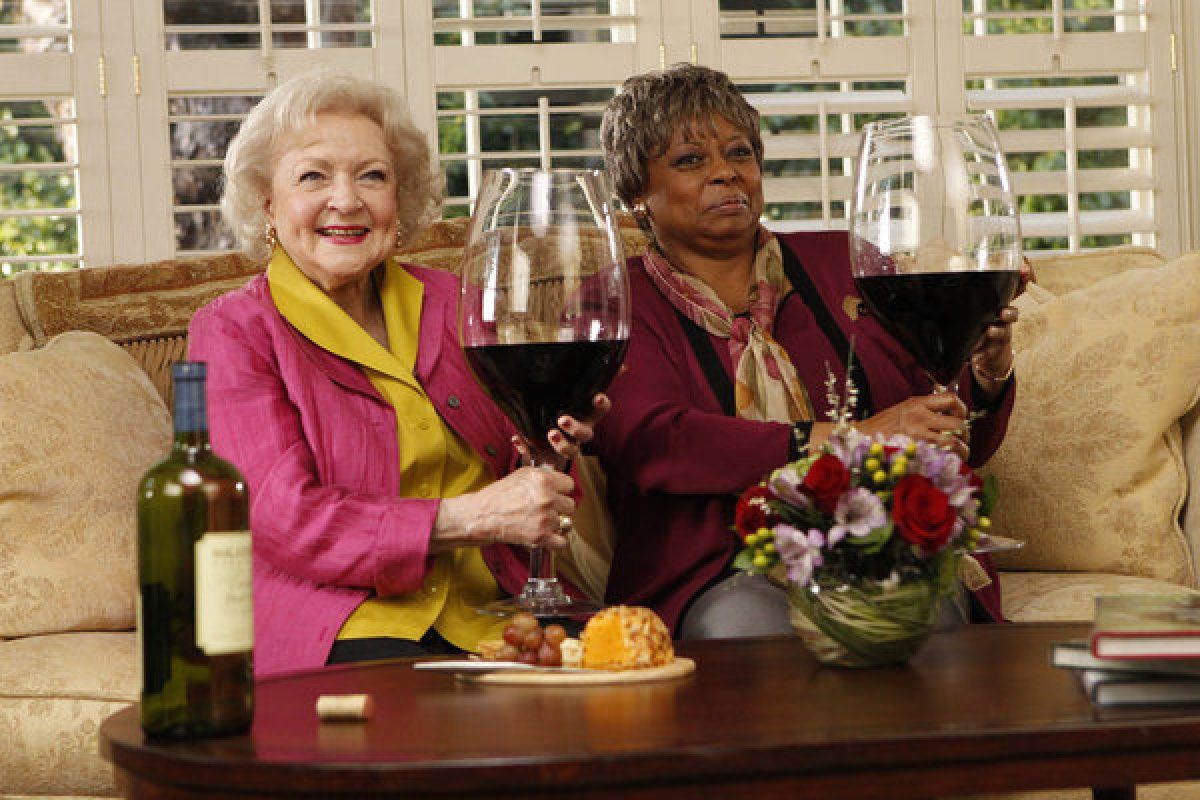 Friends enjoying a celebratory glass of wine at the end of the day